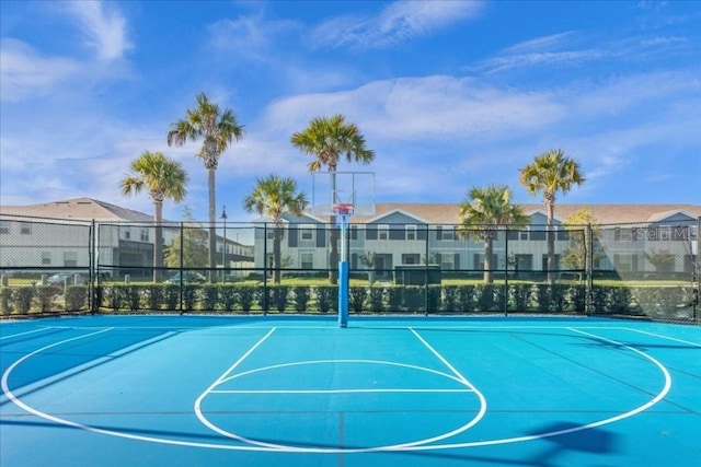 view of sport court with community basketball court, a residential view, and fence