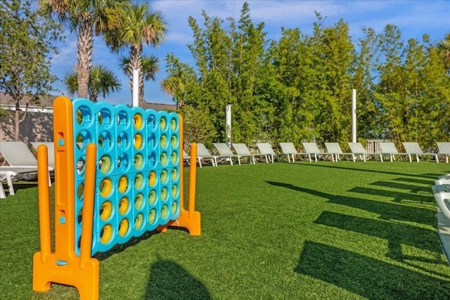 view of playground with a lawn