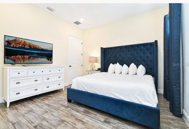 bedroom with wood-type flooring