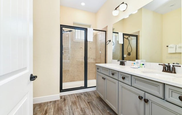 bathroom with vanity and an enclosed shower