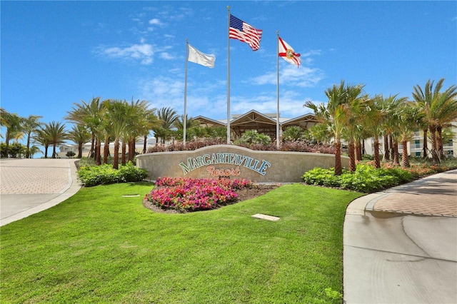 community / neighborhood sign featuring a lawn