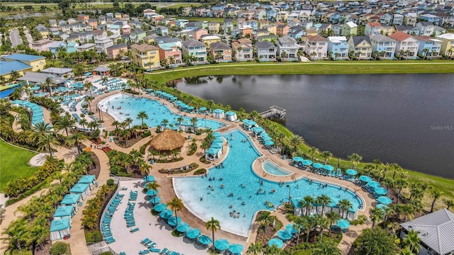 birds eye view of property with a water view