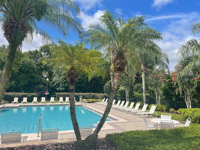 view of swimming pool featuring a patio area