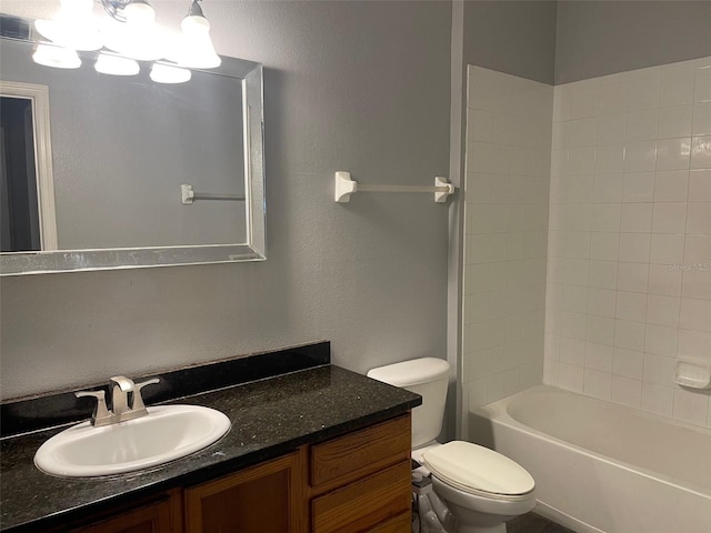 full bathroom featuring shower / bathing tub combination, vanity, and toilet