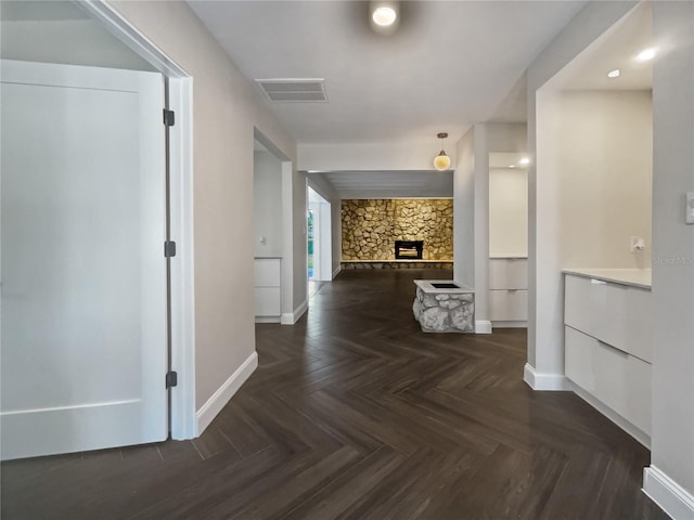 hallway featuring dark parquet floors