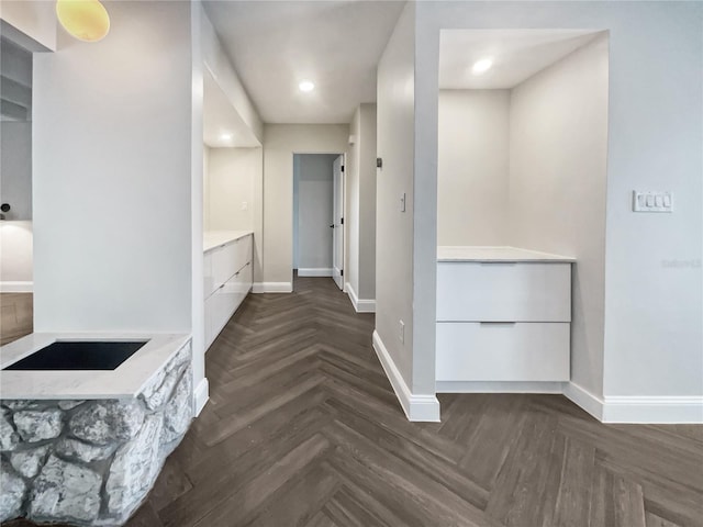 hallway featuring dark parquet floors