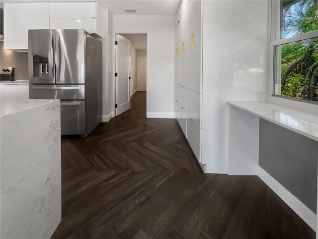 hallway with dark parquet flooring