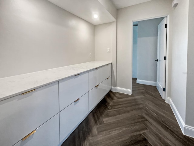 corridor featuring dark parquet floors