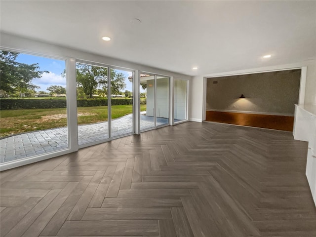 empty room with dark parquet flooring