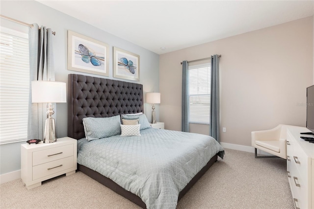 bedroom featuring light colored carpet