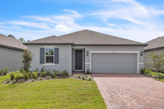 ranch-style house featuring a front yard and a garage