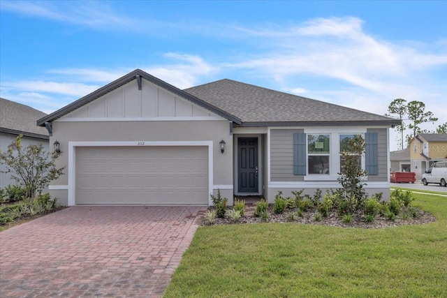 ranch-style house with a front yard and a garage