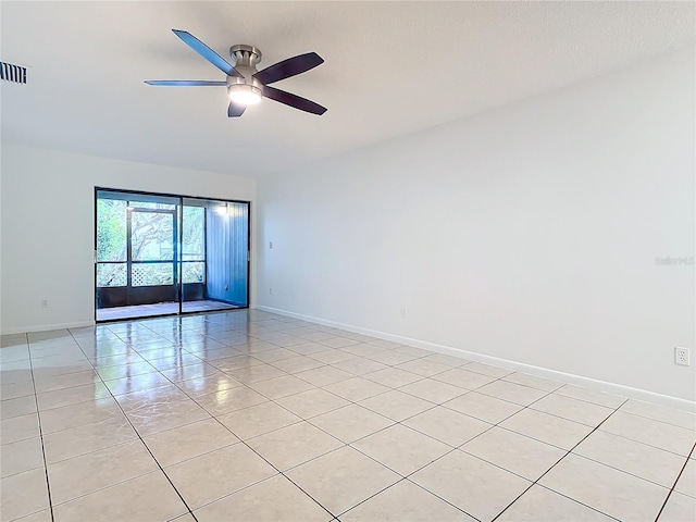 unfurnished room with ceiling fan and light tile patterned flooring