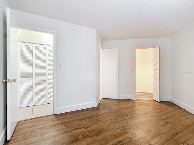 spare room featuring light hardwood / wood-style flooring