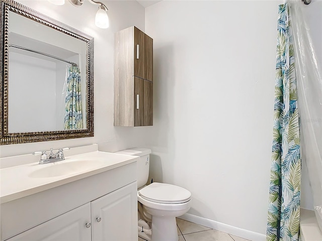 bathroom with tile patterned floors, vanity, and toilet