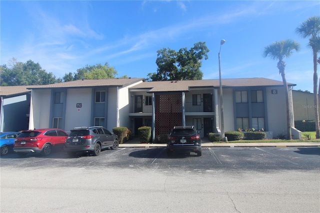 8 Escondido Cir Unit 78, Altamonte Springs, FL 32701 - view of building exterior with uncovered parking