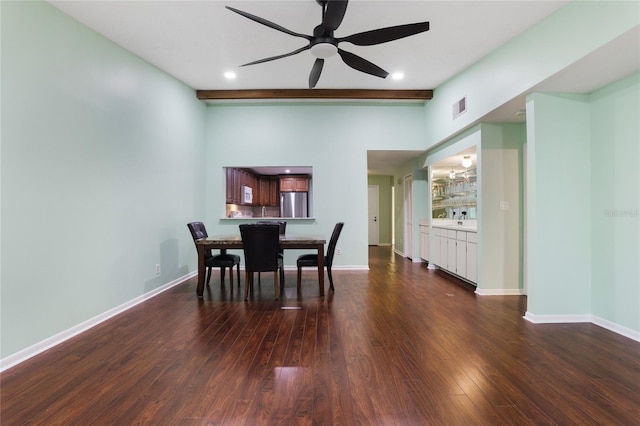 dining space featuring ceiling fan and dark hardwood / wood-style floors