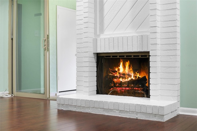 room details featuring hardwood / wood-style floors and a fireplace