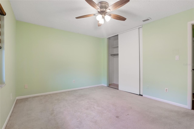8 Escondido Cir Unit 78, Altamonte Springs, FL 32701 - unfurnished bedroom featuring light colored carpet, a closet, a ceiling fan, and baseboards