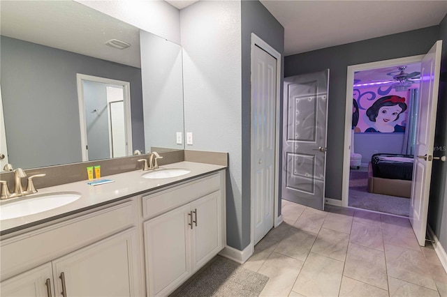 bathroom with tile patterned floors and vanity