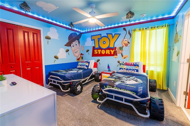 carpeted bedroom featuring a closet and ceiling fan