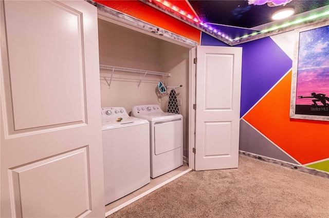 washroom with carpet floors and washing machine and clothes dryer