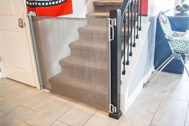 stairs with tile patterned floors