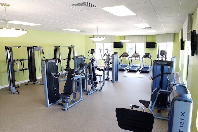 exercise room with a drop ceiling