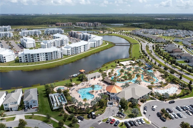 birds eye view of property with a water view