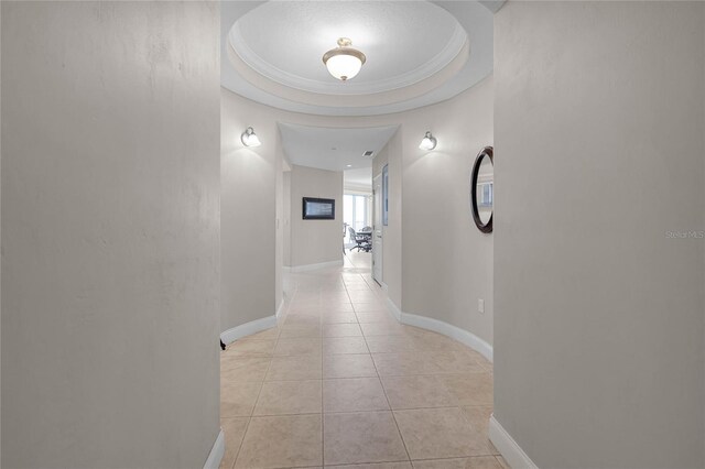 corridor with light tile patterned floors