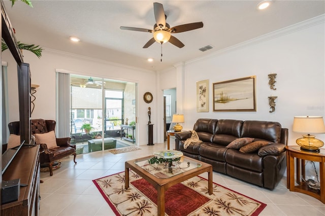 living room with crown molding, light tile patterned flooring, and ceiling fan