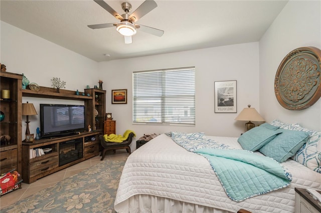 tiled bedroom with ceiling fan