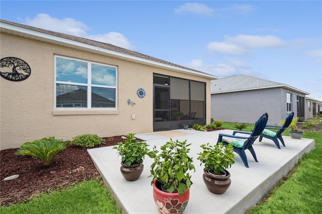 rear view of property featuring a patio area