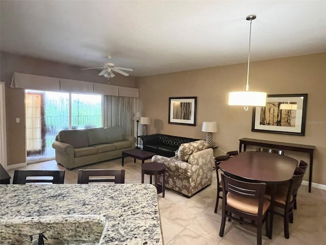 living room with ceiling fan and light tile floors