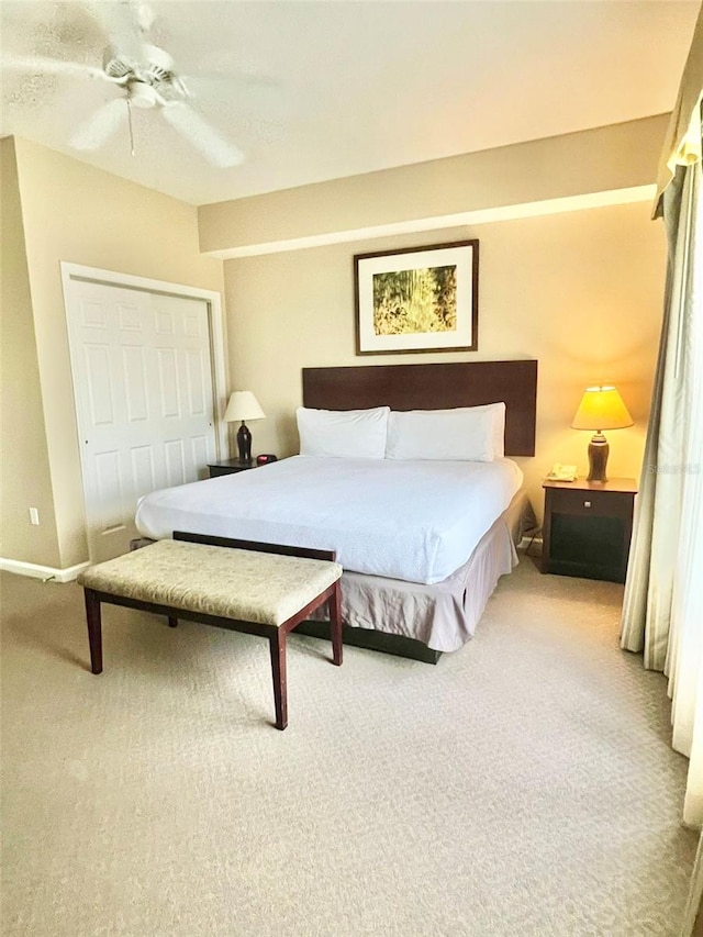 bedroom featuring carpet, a closet, and ceiling fan