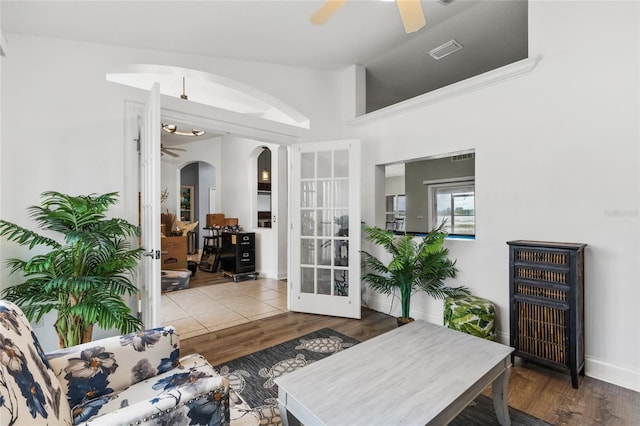 living room featuring french doors and hardwood / wood-style floors