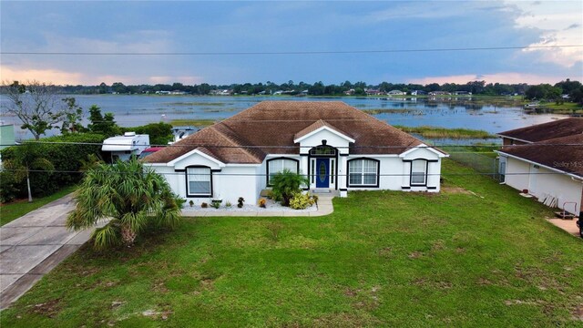 exterior space with a yard and a water view