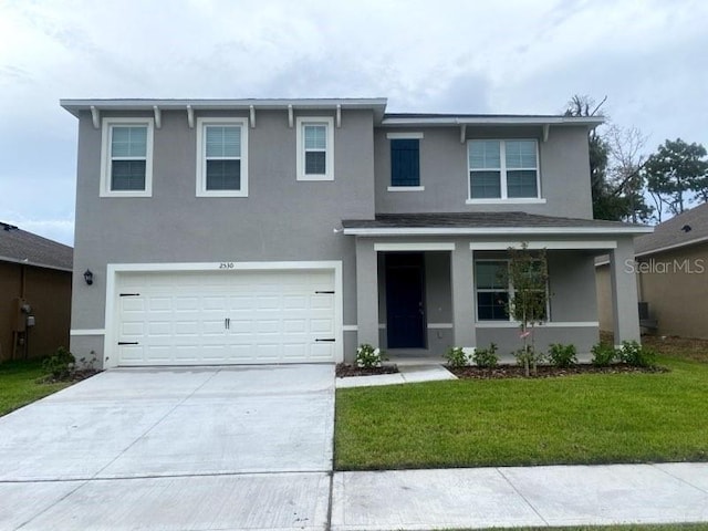 front of property with a garage and a front yard