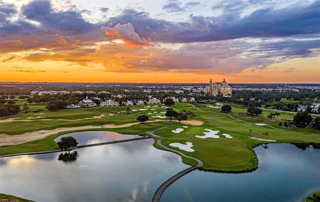 aerial view with a water view and golf course view