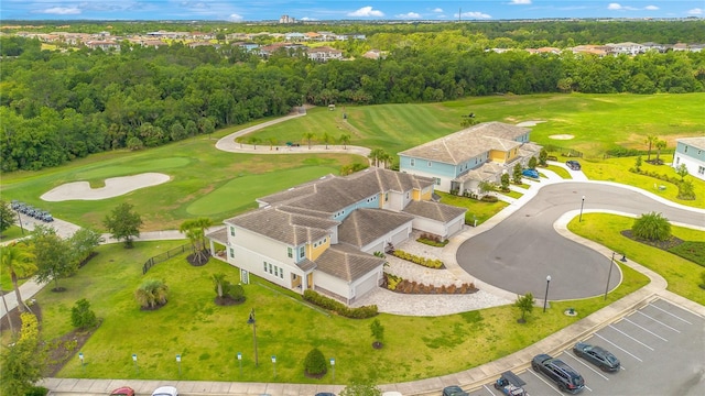 aerial view with a forest view and golf course view