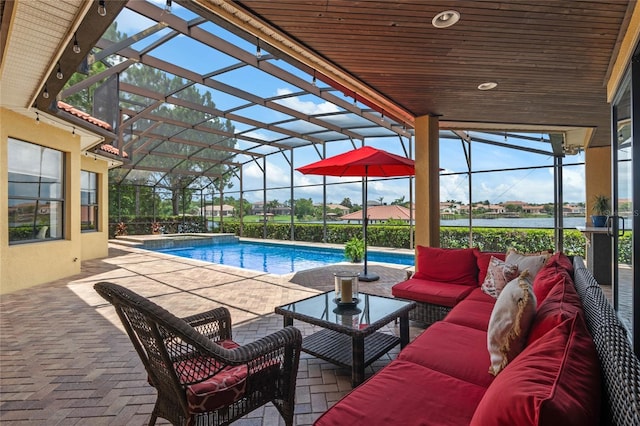 view of swimming pool featuring a lanai, an outdoor living space, a water view, and a patio