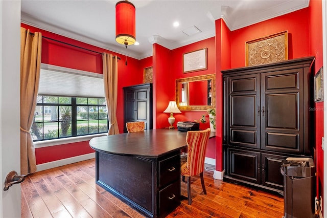 office with hardwood / wood-style flooring and crown molding