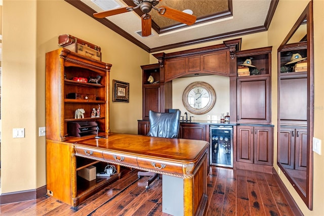 office space with ceiling fan, beverage cooler, dark wood-type flooring, and ornamental molding