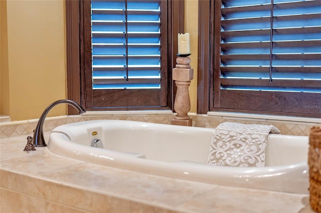 bathroom with tiled tub