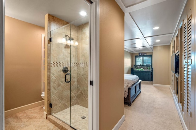 bathroom featuring toilet and a shower with door