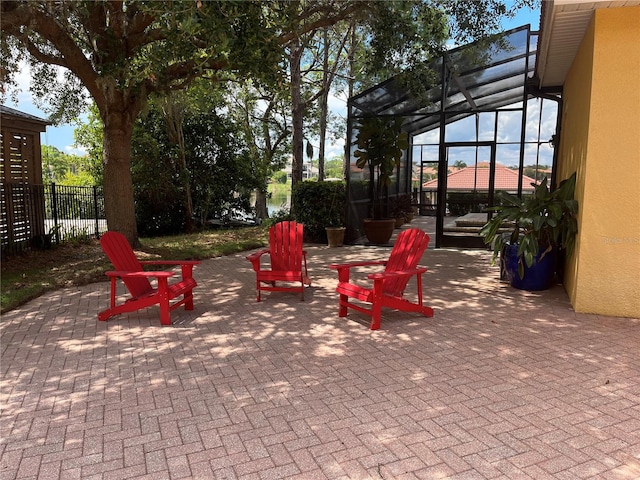 view of patio / terrace featuring glass enclosure