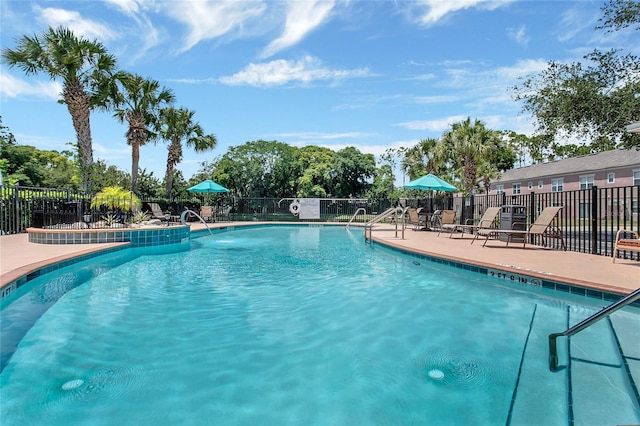 view of swimming pool featuring a patio area