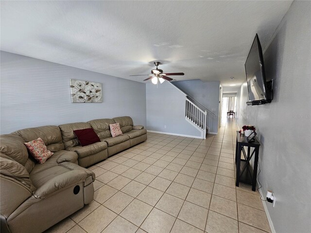 living room with ceiling fan and light tile floors