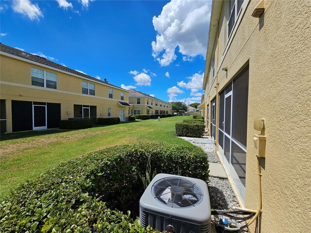 view of yard featuring central AC unit