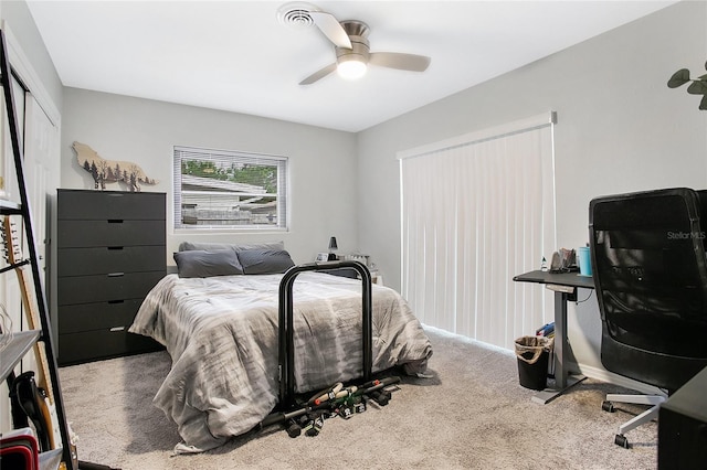 carpeted bedroom with ceiling fan